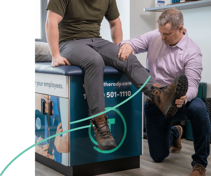 Onsite therapist tending to injured worker