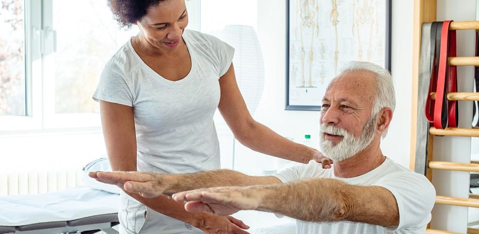 physical therapist working with patient