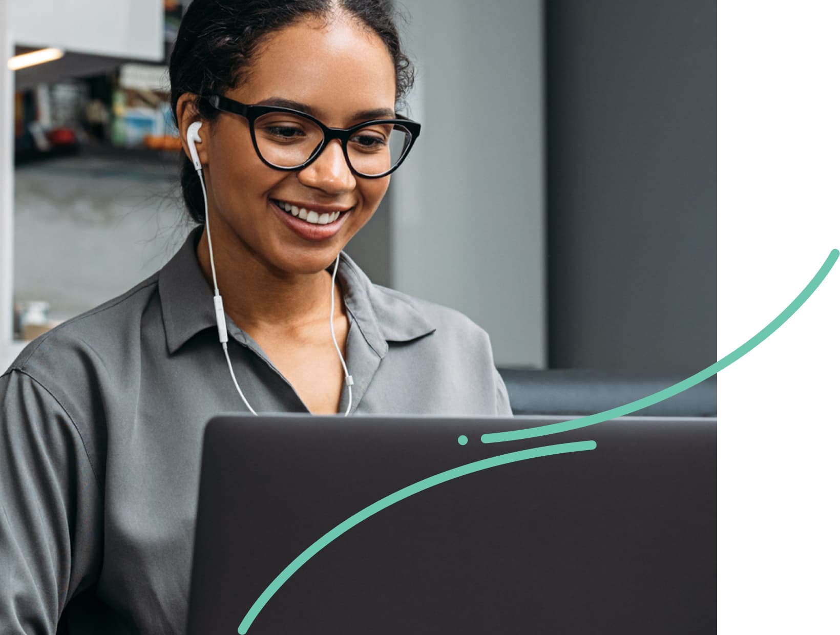 woman smiling at laptop